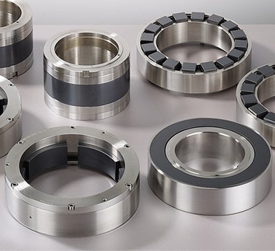 Ceramic thrust and journal bearings for water injection pumps